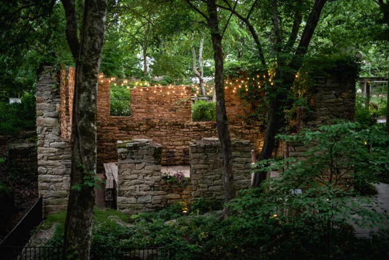 Looking down at The Mill at Fine Creek Ruins in the evening, with the golden lights shining